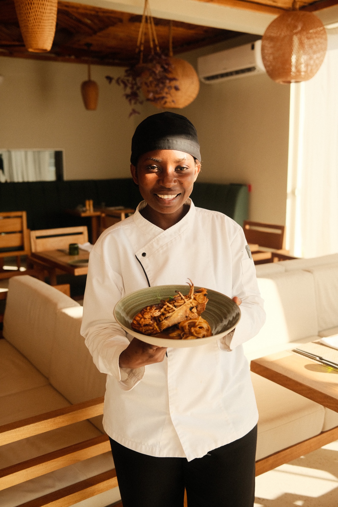 Local chef presenting a plated dish